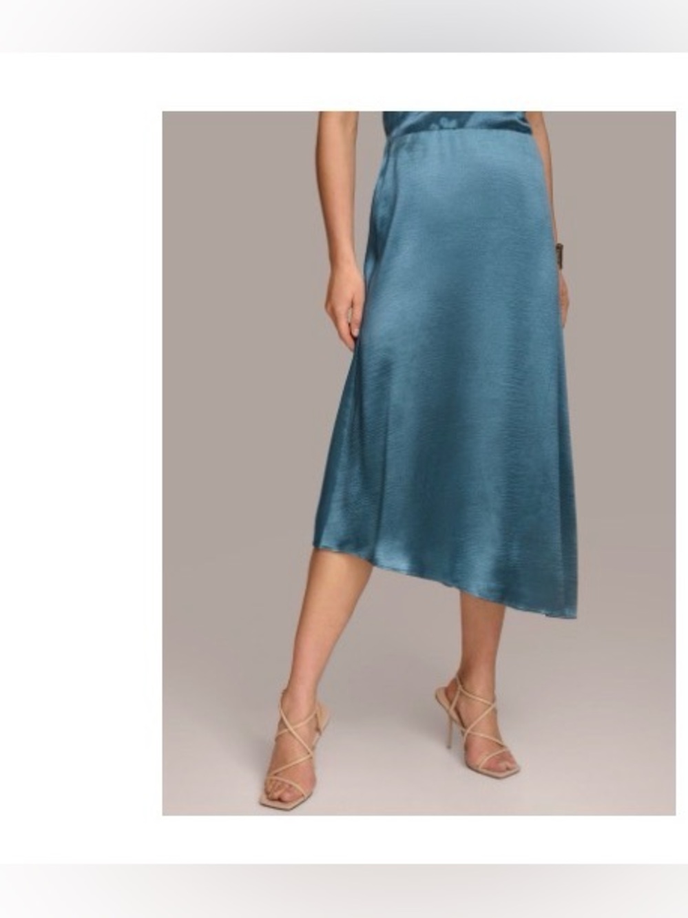 DONNA KARAN
ASYMMETRICAL
FLARE HEM SKIRT. Tide Blue 
Sz 6. NWT